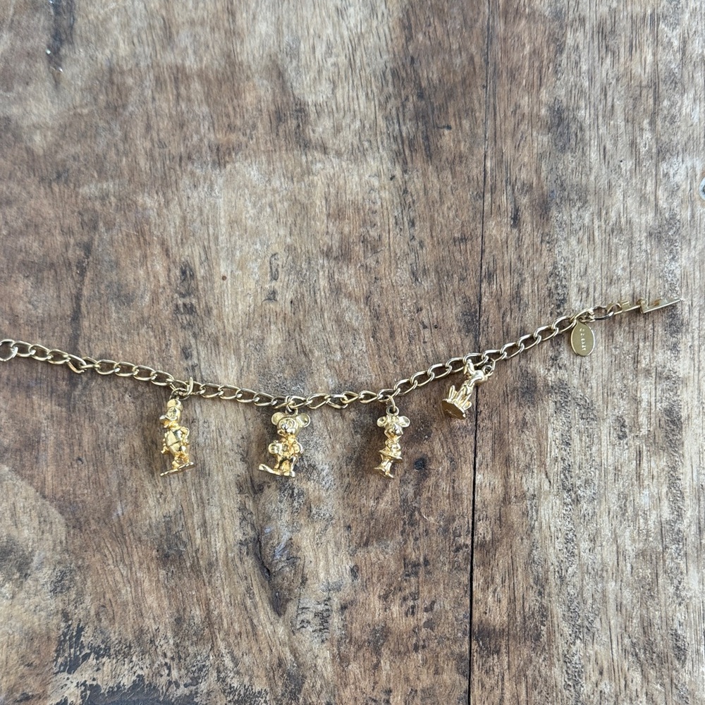 Disney Gold tone Charm Bracelet with mickey mouse goofy minnie mouse etc Charms